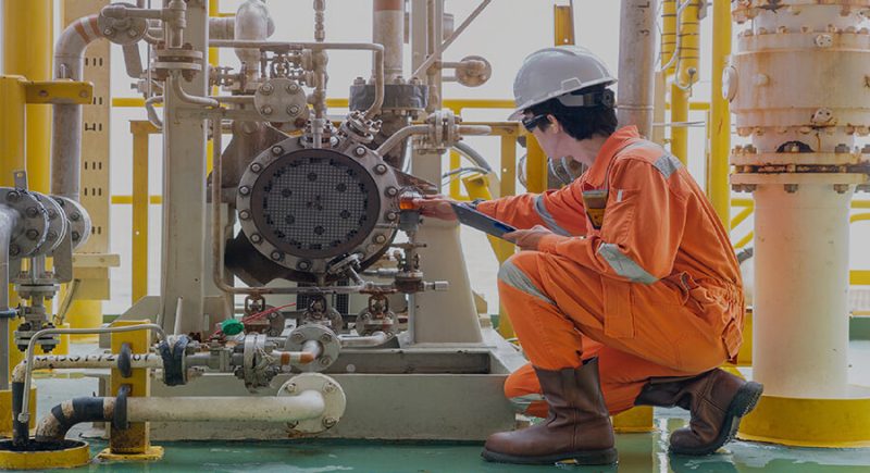 an employee checking if the equipment is working properly