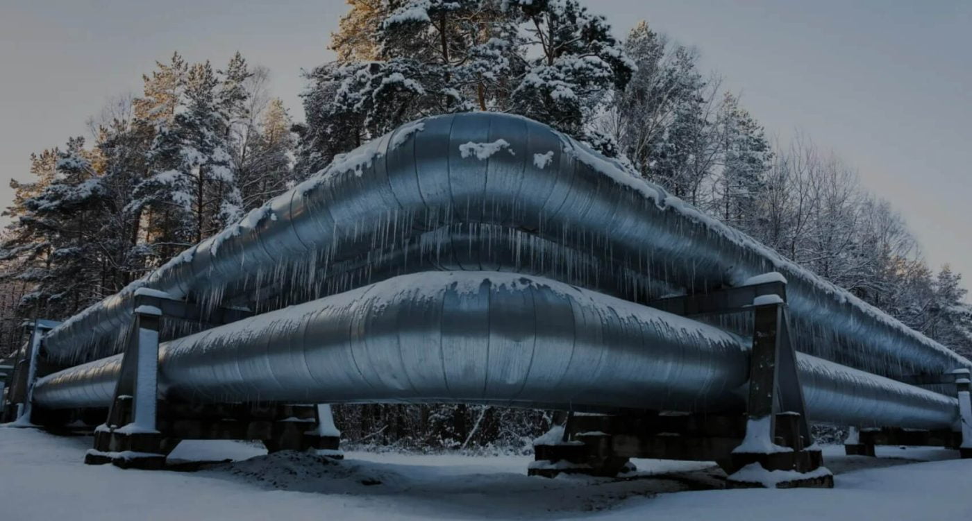 pipelines in the winter, surrounded by snow